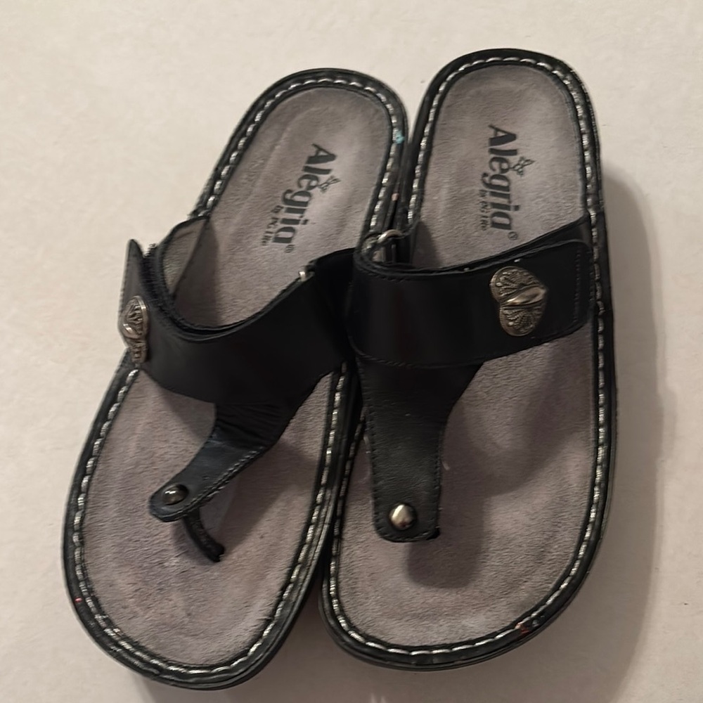 Alegria Black Leather Flip-Flops with Heart Accent